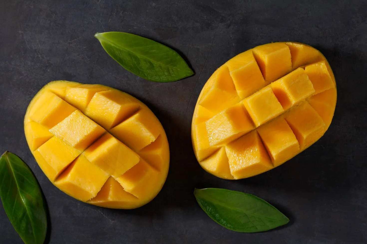 Two cut mangoes